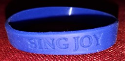 Show details for Sing Joy Wristband Picture of Sing Joy Wristband
